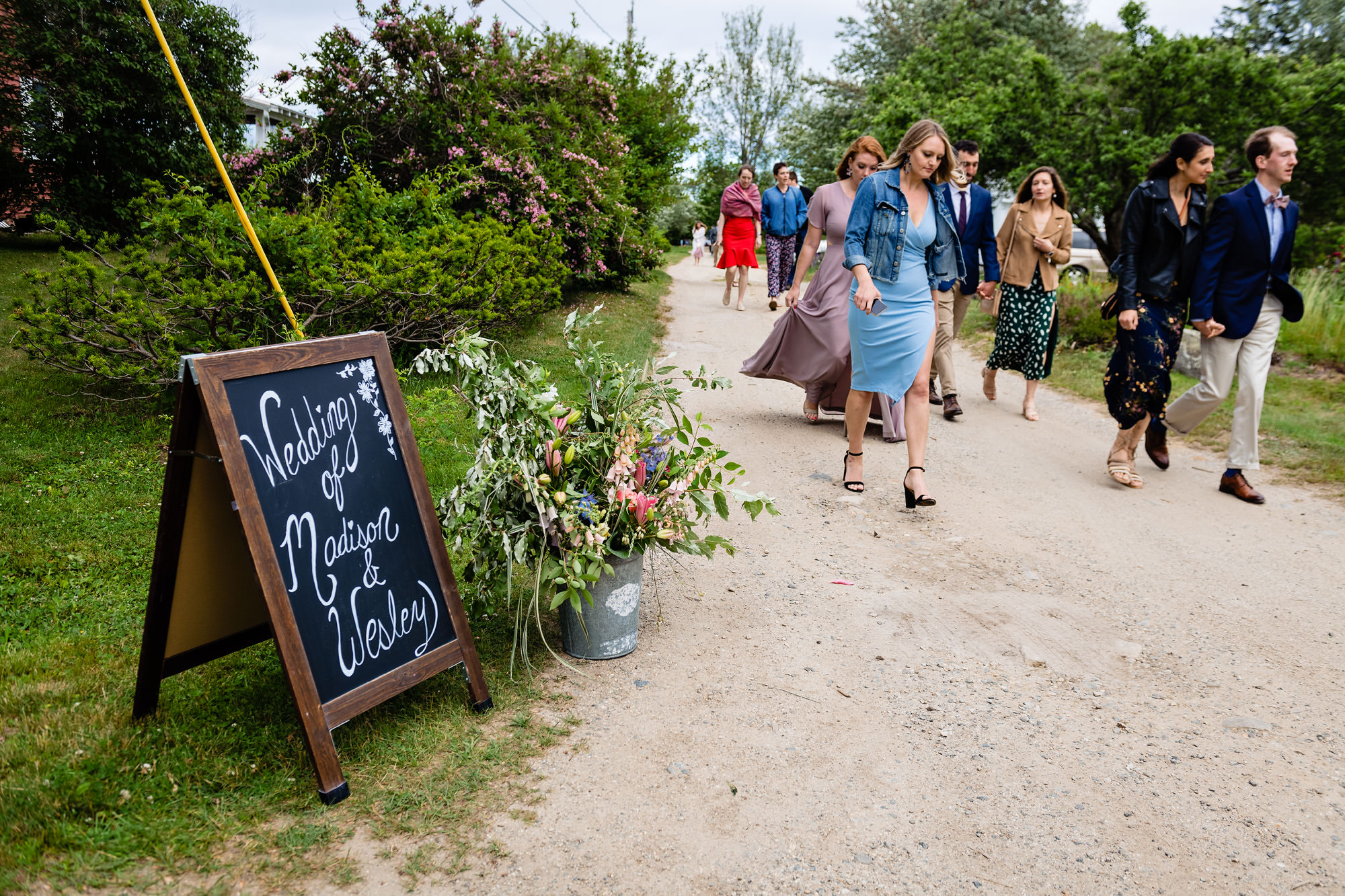 Guests walk to Chebeague Island Inn for a wedding reception