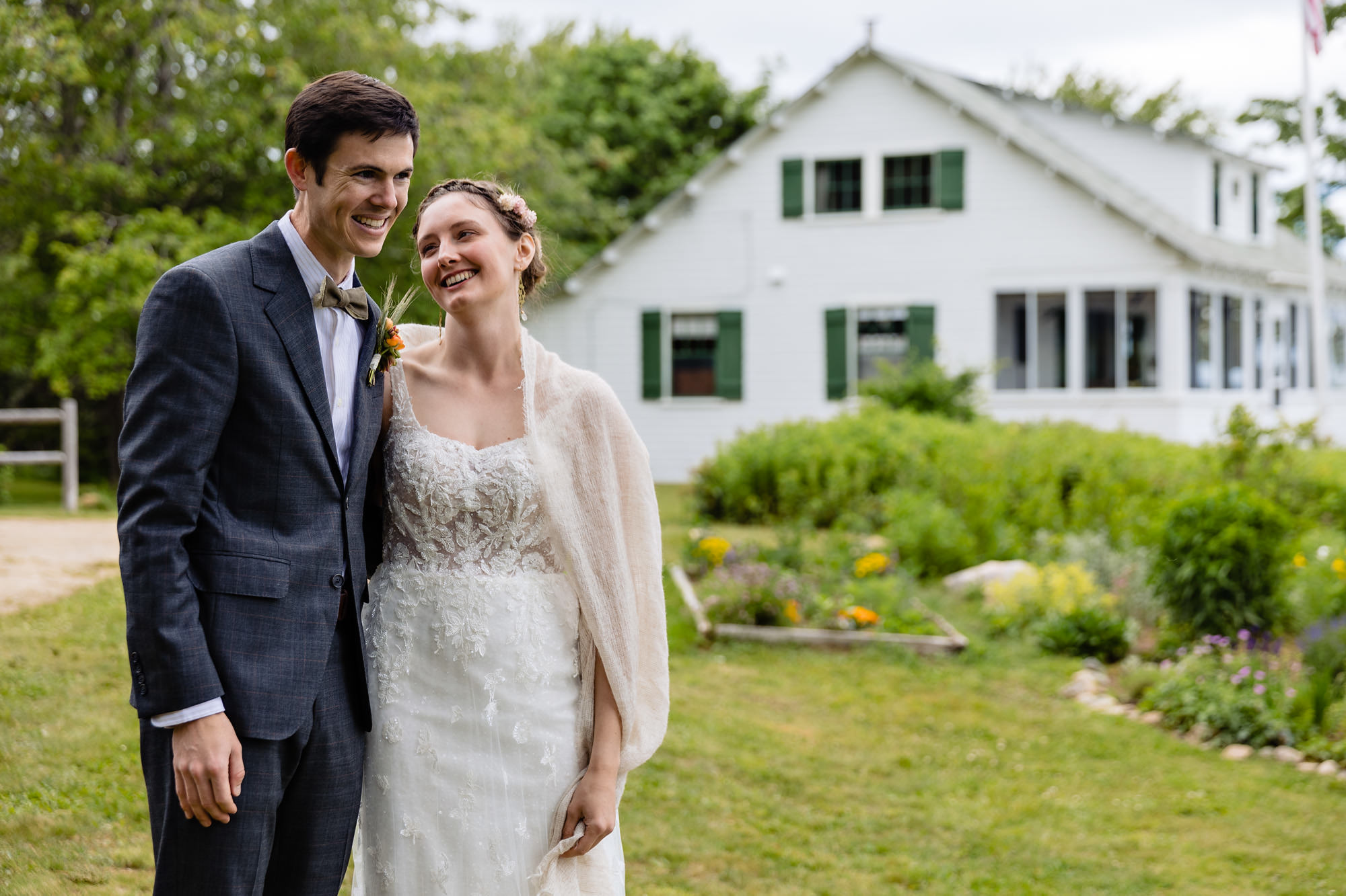 A stunning first look prior to a wedding on a beach on Chebeague Island, Maine