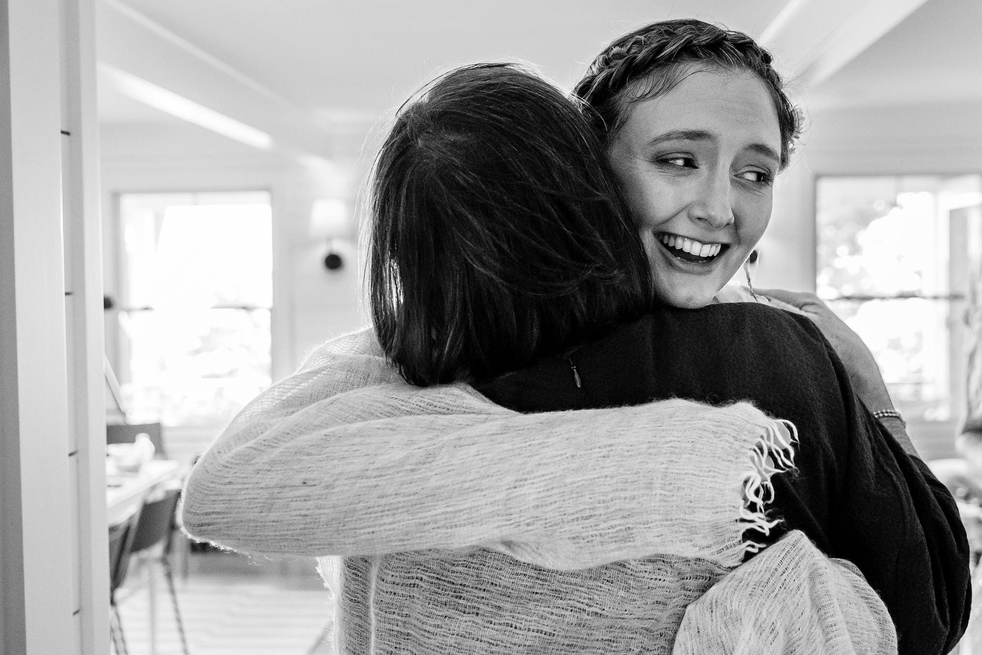 The bride gives hugs after the Chebeague Island wedding ceremony