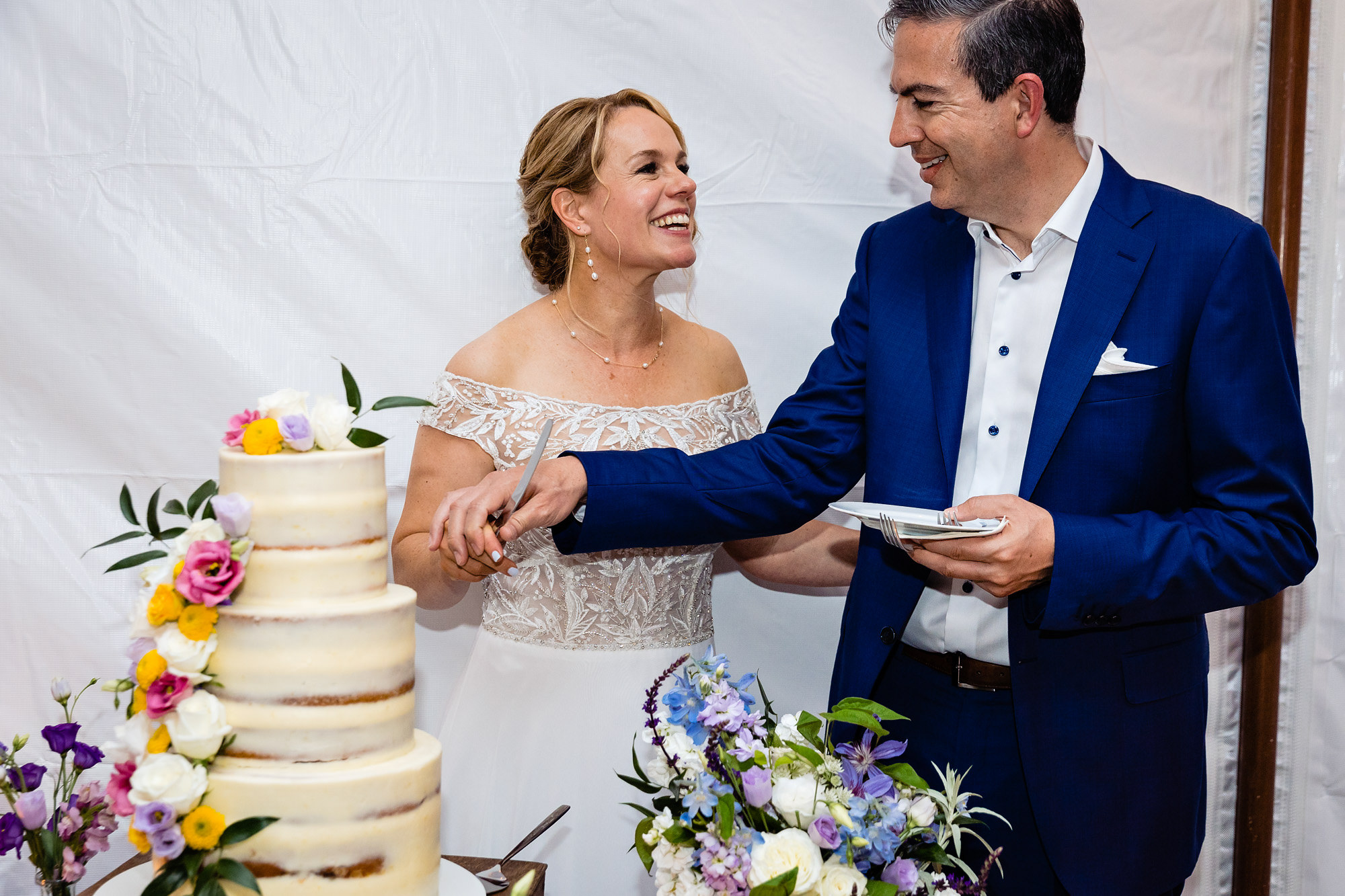 A stunning cake cutting at a private estate wedding in Maine