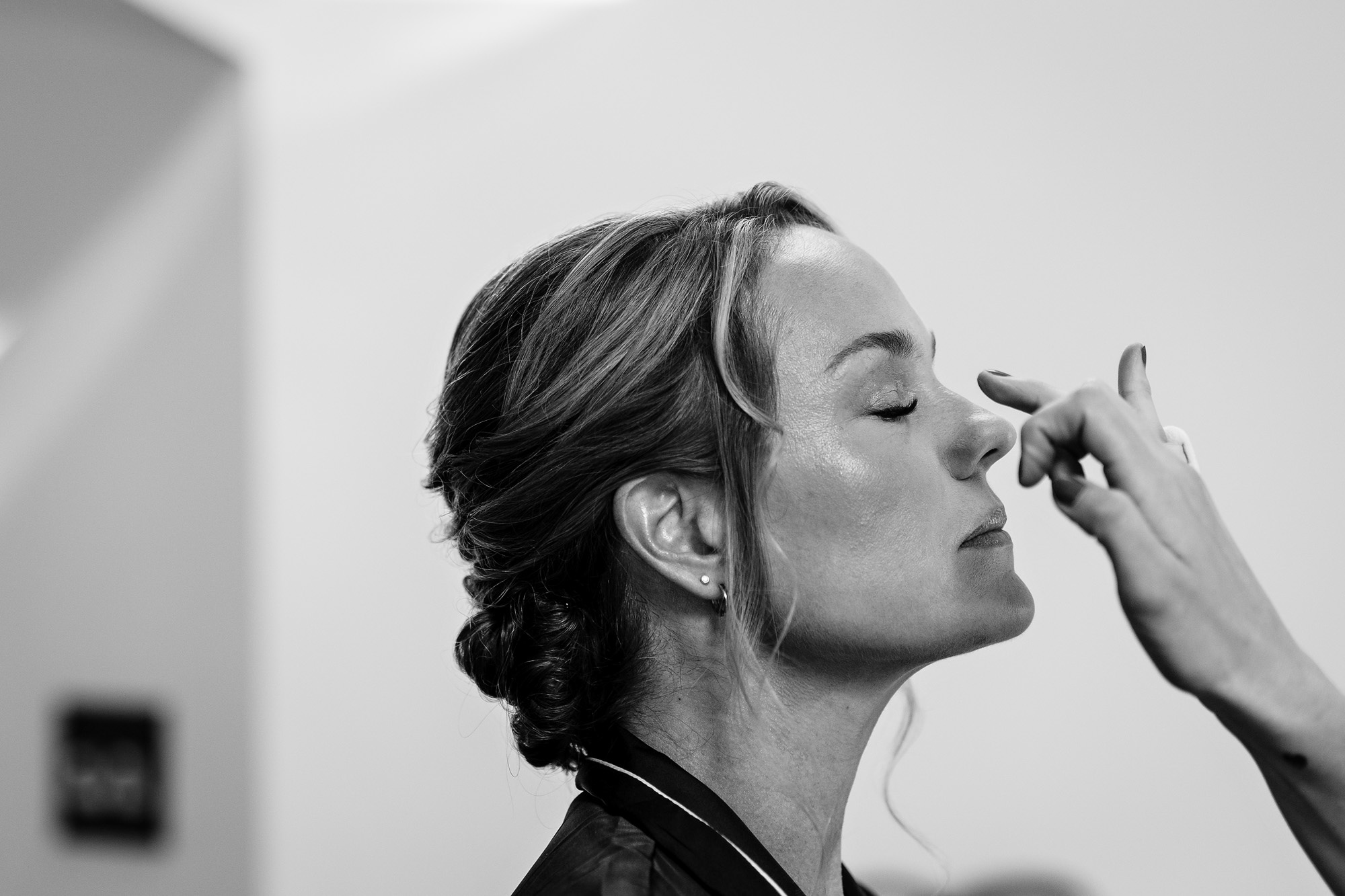 The bride gets ready at a wedding at an estate in Maine