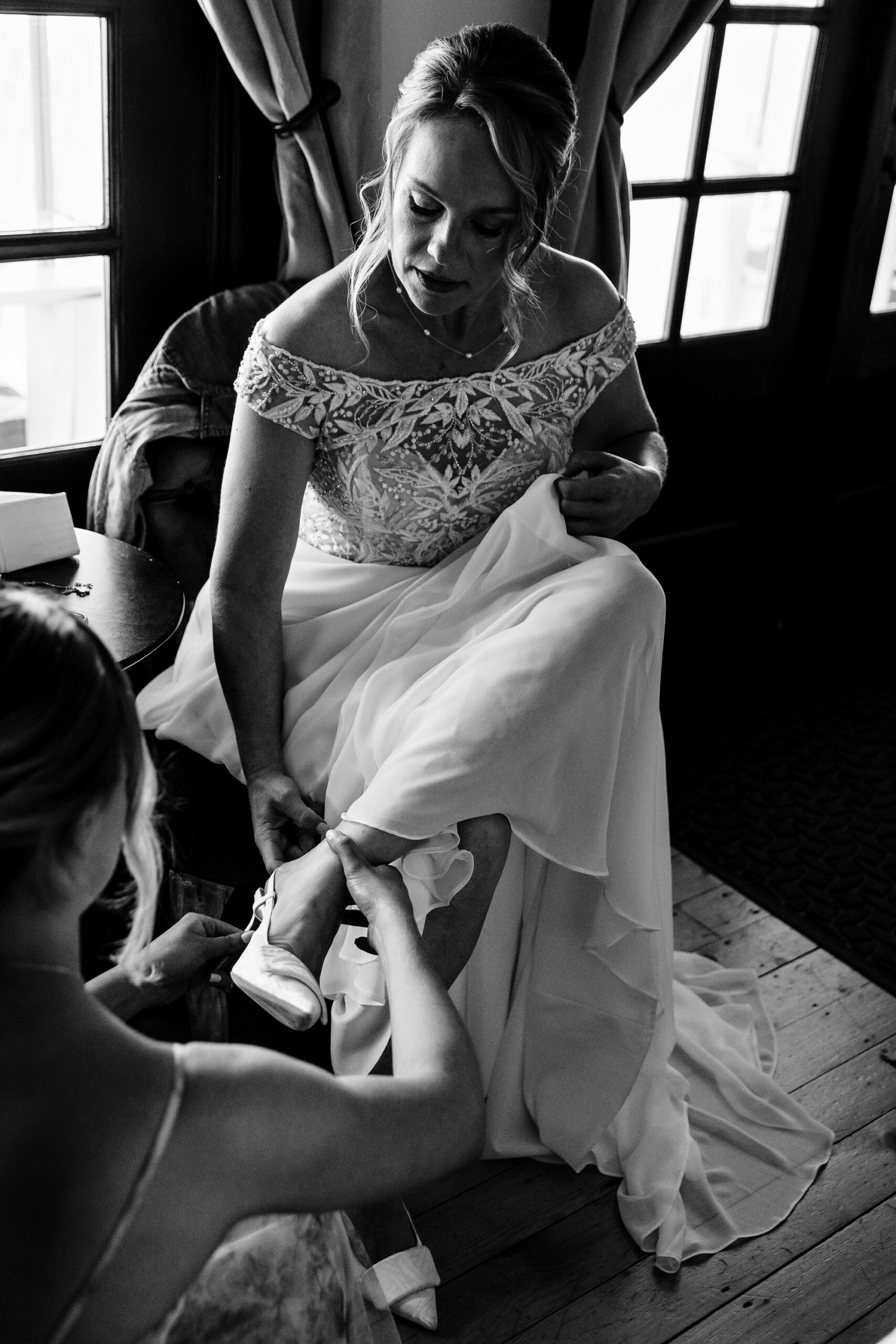 The bride gets ready at a wedding at an estate in Maine