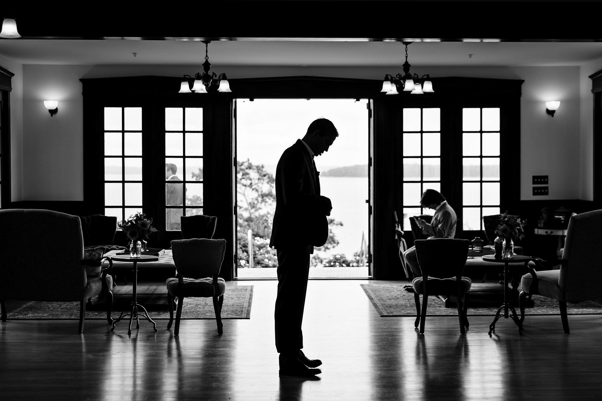 The groom prepares for a wedding at a private estate in Maine