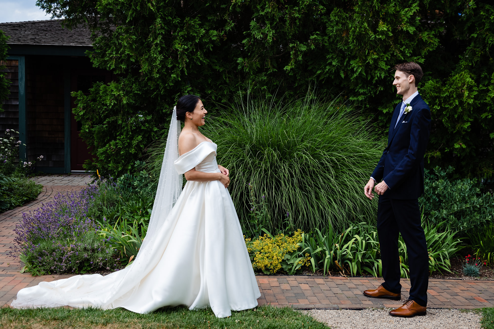 A wedding couple share a first look at Strawbery Banke Museum in Portsmouth, NH.