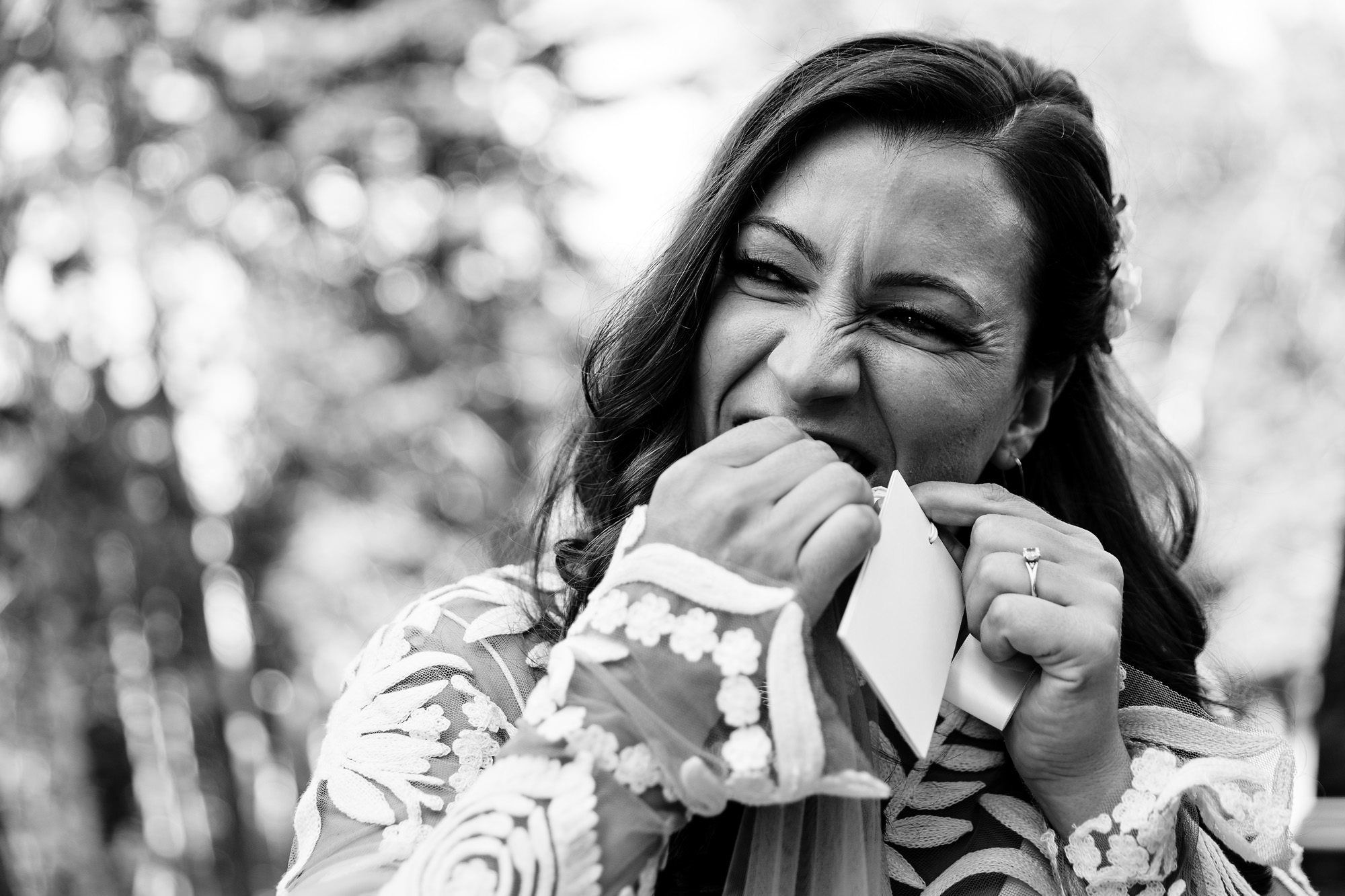 Rachel struggles with removing the tag from her veil at her Acadia elopement