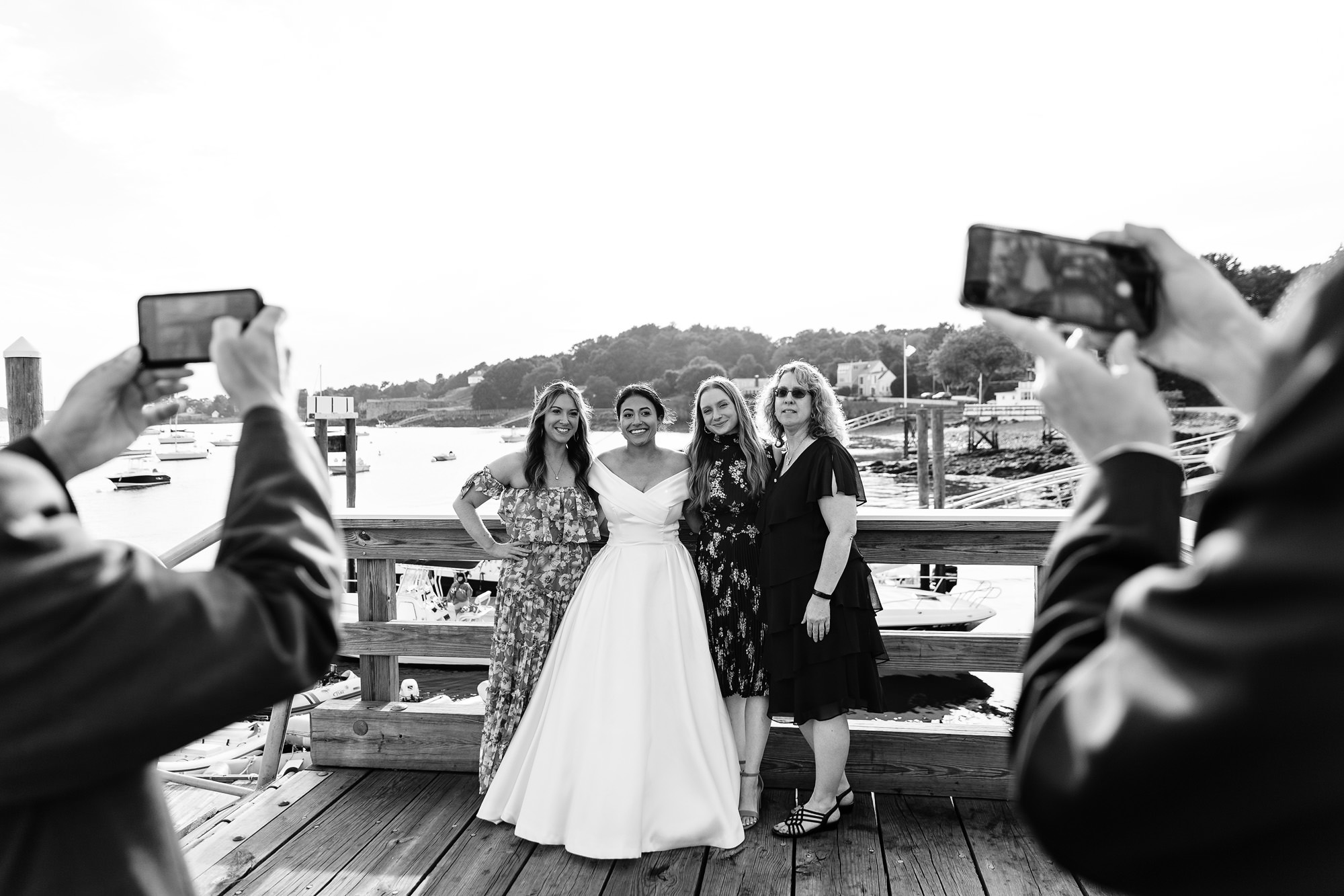Friends and family take group portraits during cocktail hour at View at Pepperrell Cove