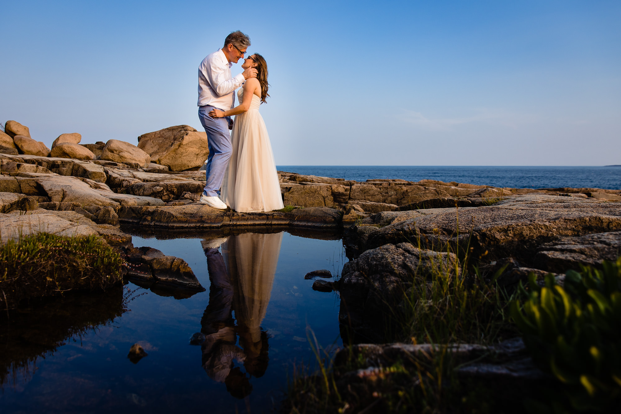 A unique reflection portrait in a tidal pool for an Acadia elopement couple