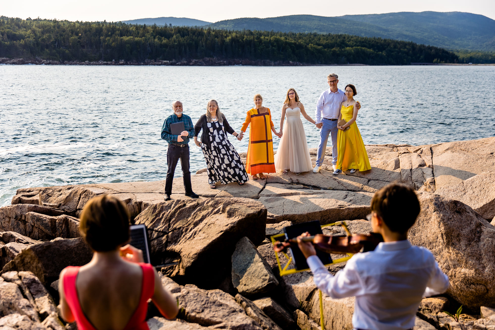 The couples kids play a song at an Acadia elopement