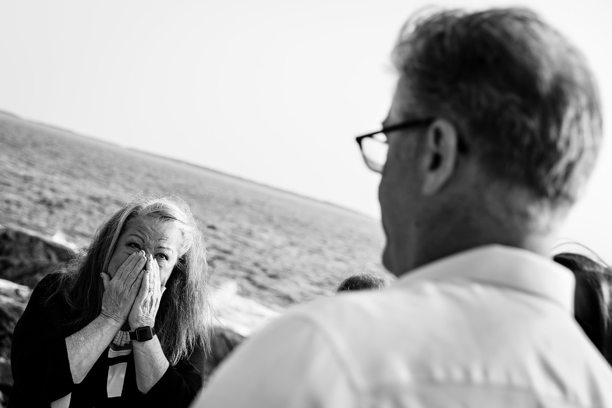 The mother of the groom is emotional during an Acadia oceanside elopement
