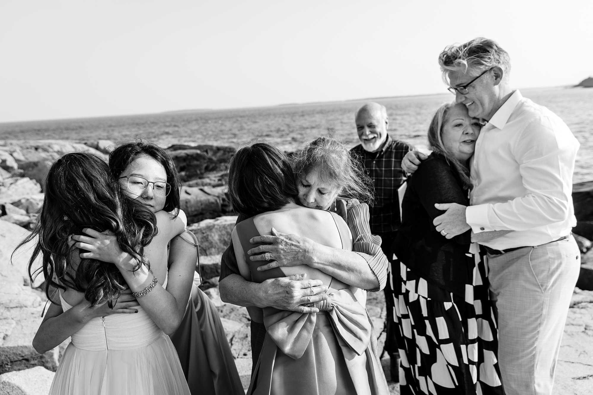 Lots of hugs during an Acadia elopement on the ocean