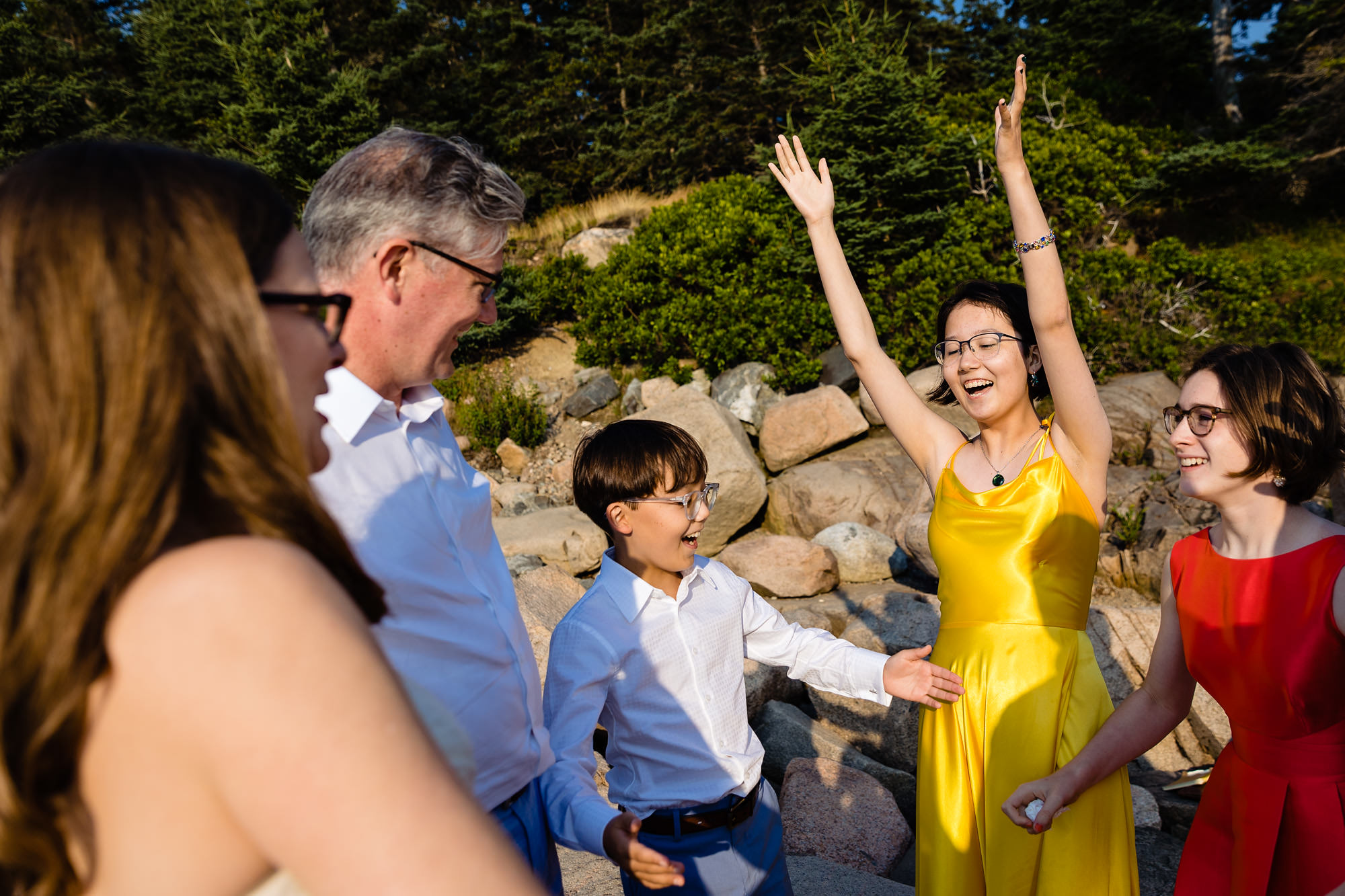 The couple's children embrace them during their Acadia elopement