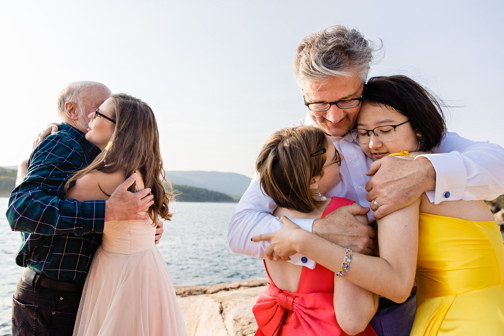 Lots of hugs during an Acadia elopement on the ocean