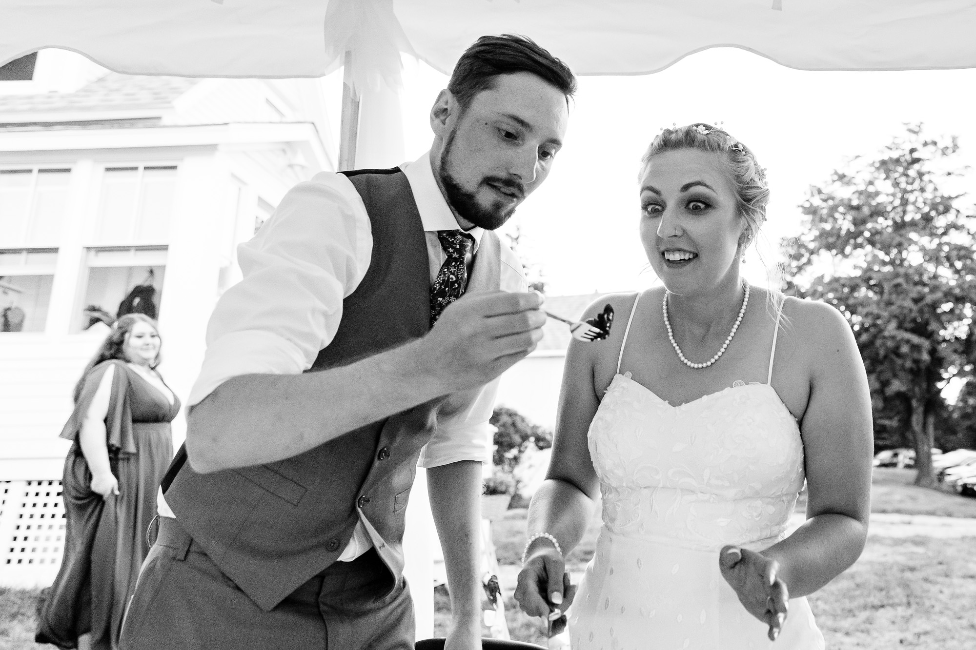 A cake cutting at a Maine island wedding