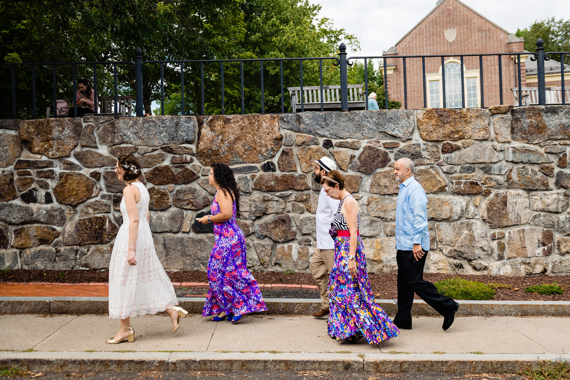 The bride and groom walk to their Camden Amphitheater wedding in Maine