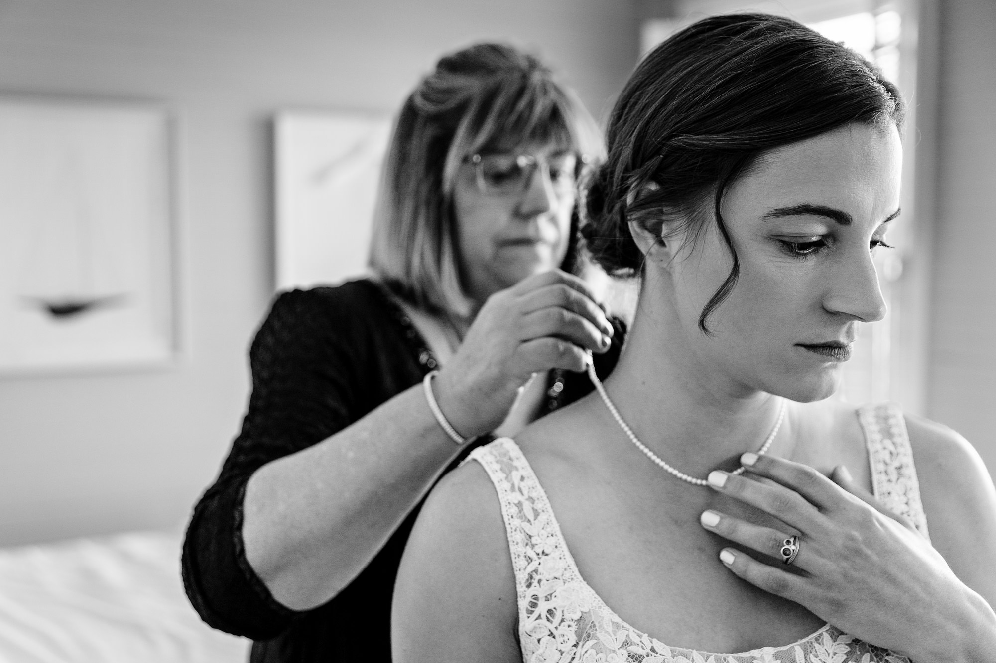 A bride gets dressed for her Grey Havens Inn wedding