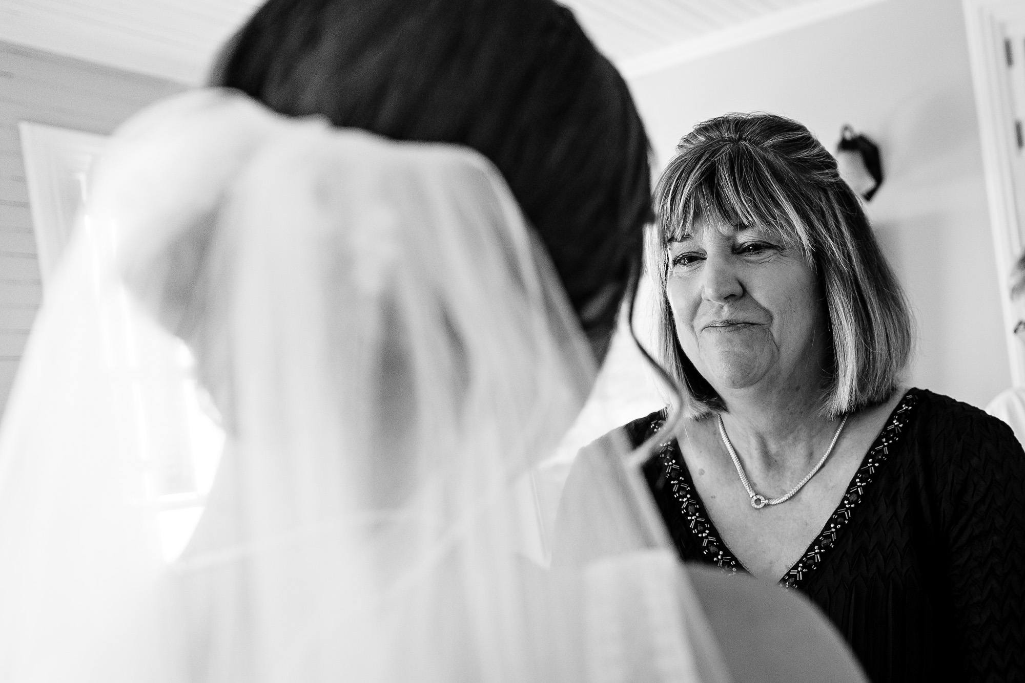 A bride gets dressed for her Grey Havens Inn wedding