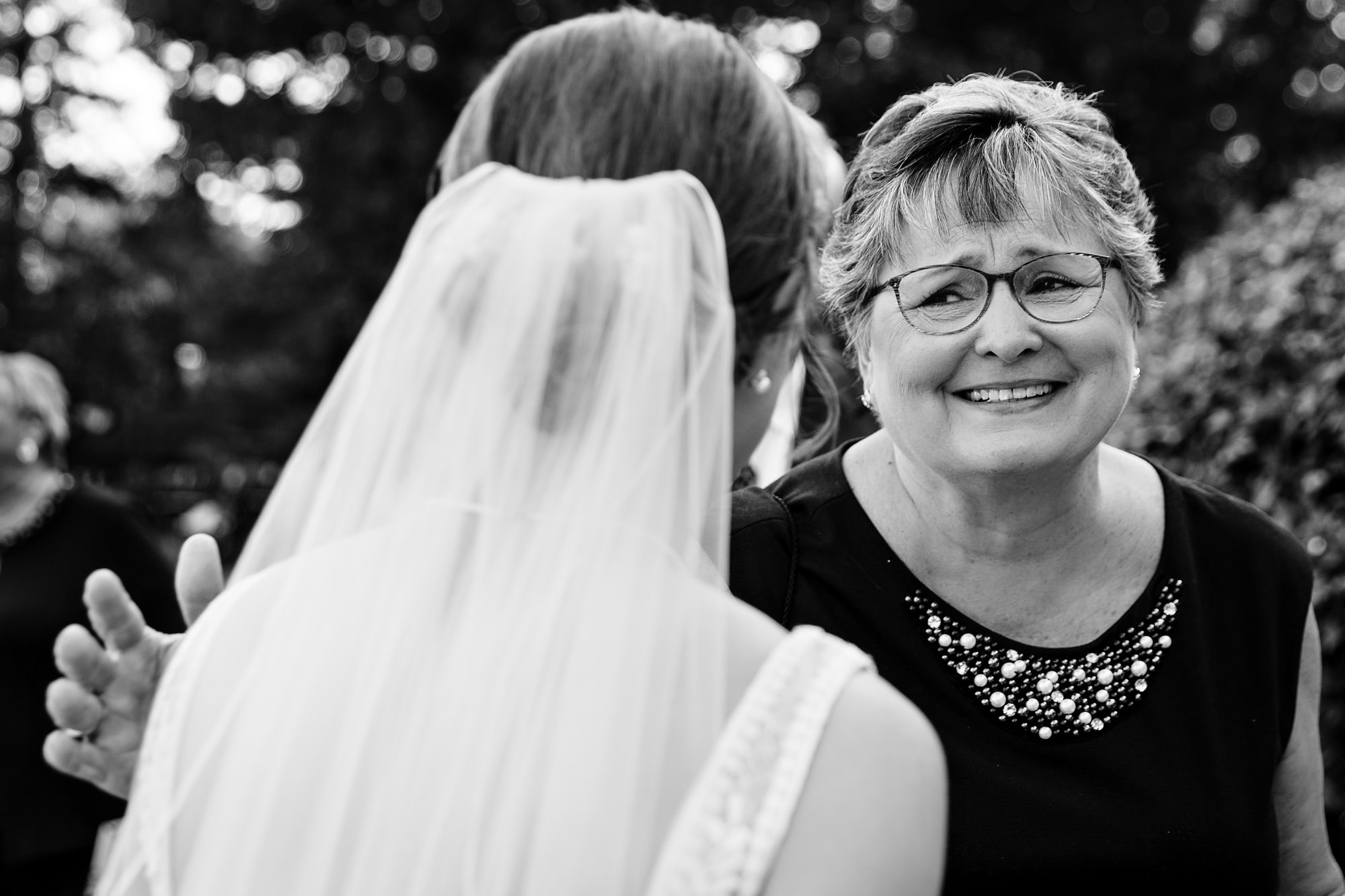 Hugs after a stunning coastal wedding ceremony in Georgetown, Maine