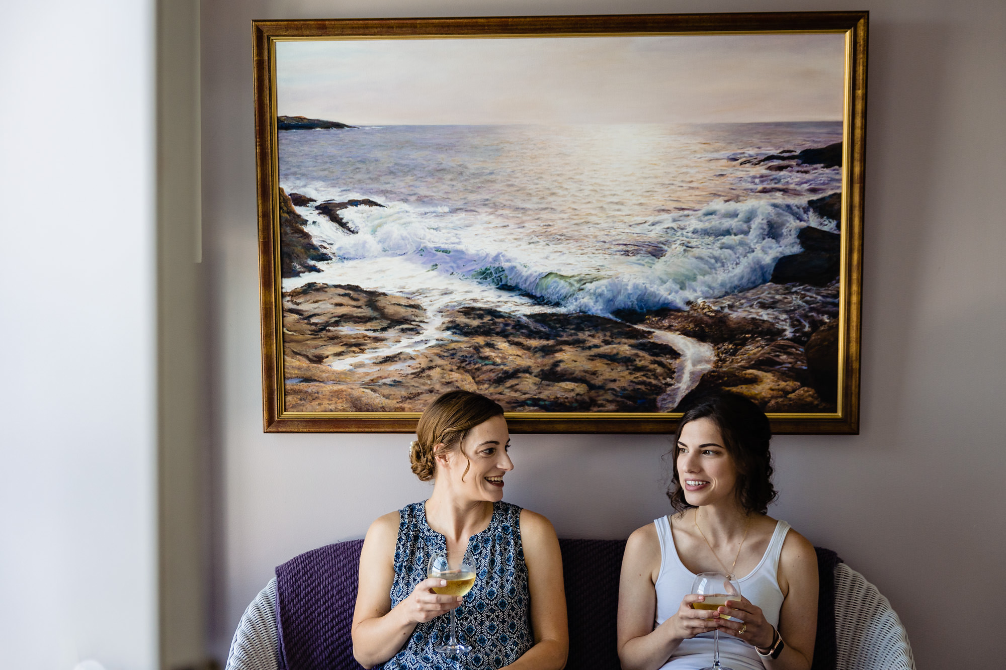 A bride and matron of honor spend time together before her Grey Havens Inn wedding in Georgetown, Maine