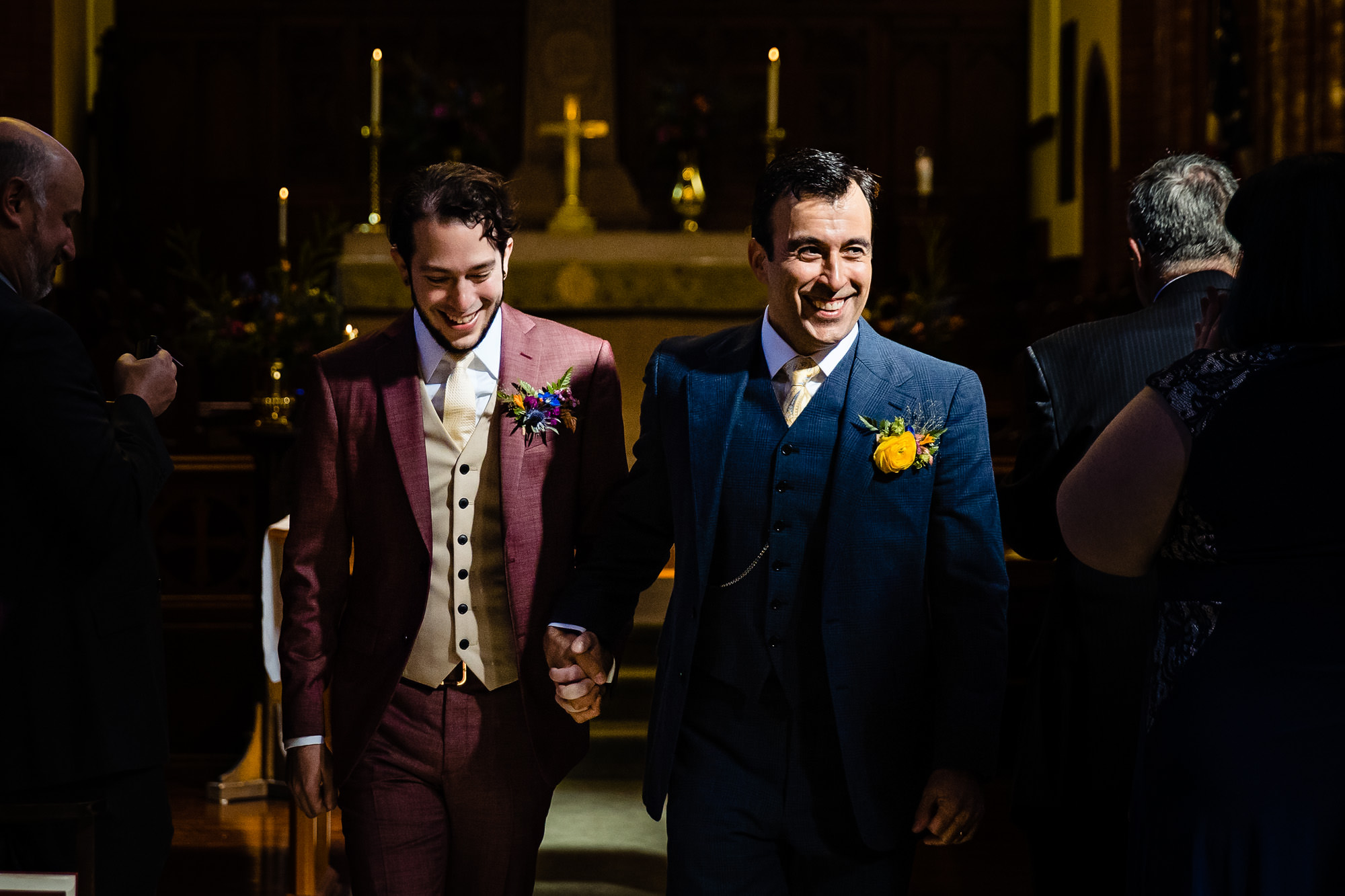 Two grooms are newly married at their St Mary's-By-The-Sea wedding ceremony