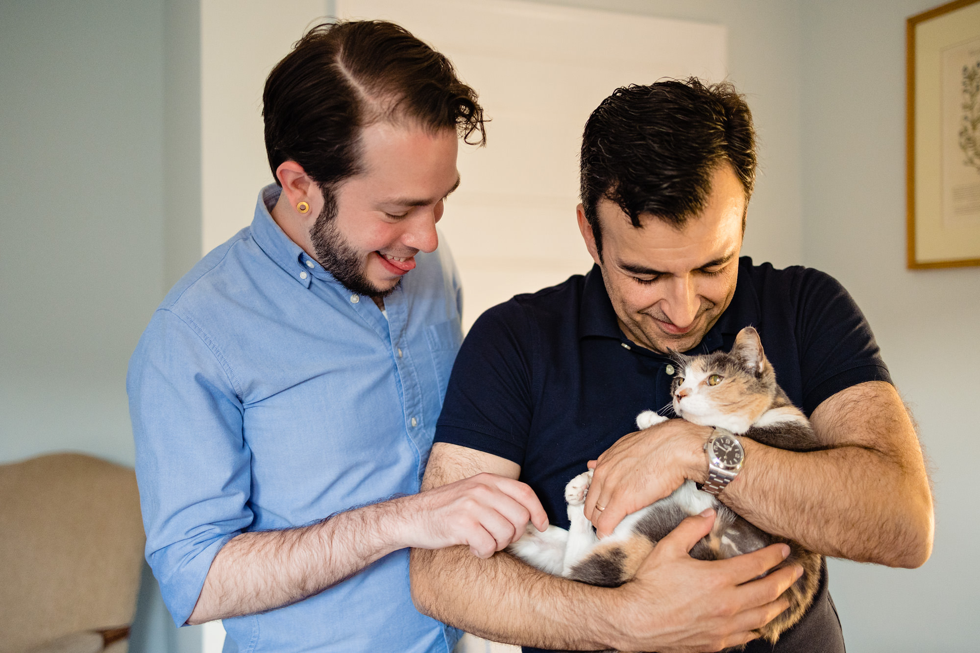 A couple poses with their cat at the Asticou Inn in Northeast Harbor, Maine.