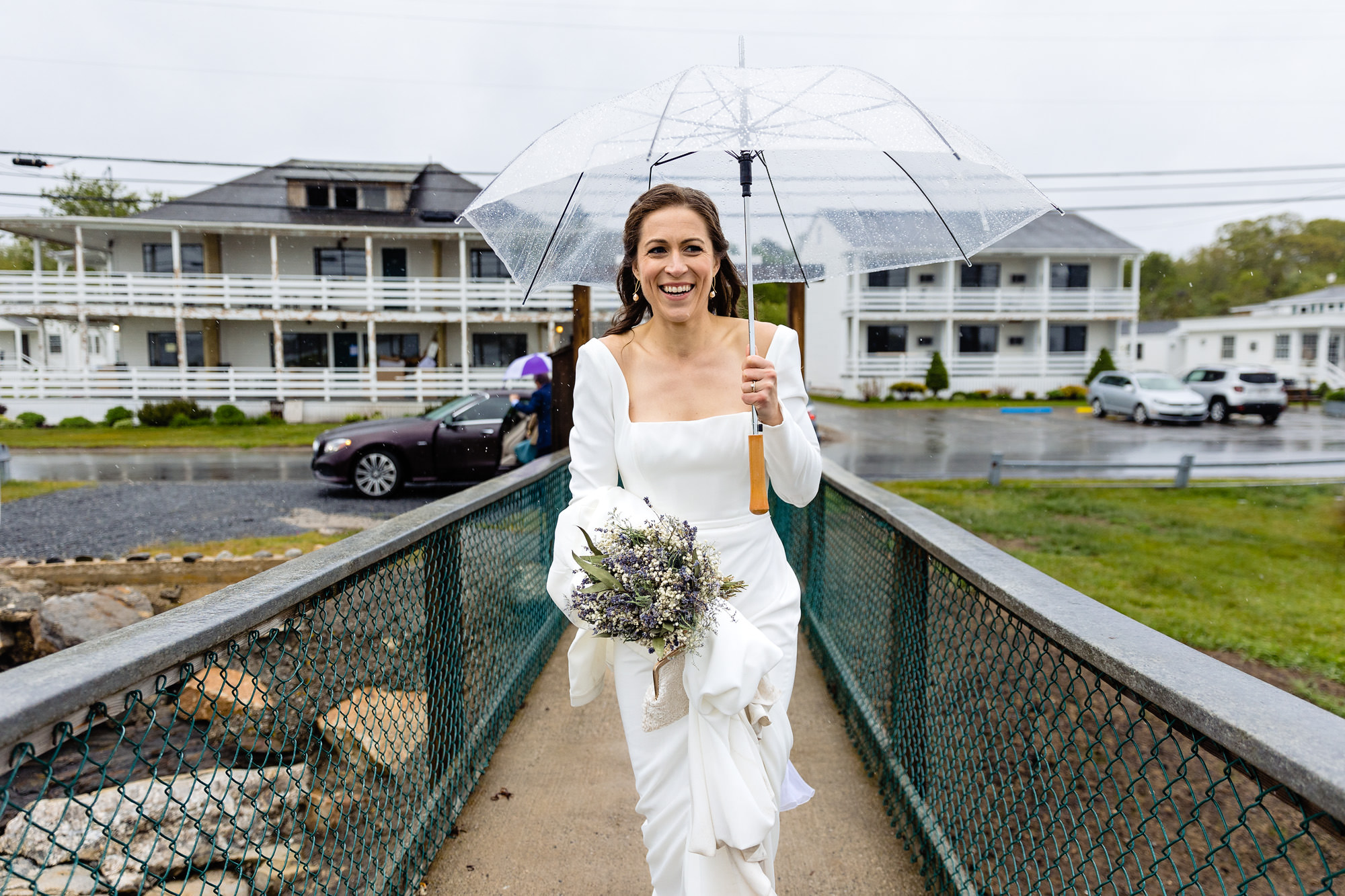 The bride walks to the boat on her wedding day in Boothbay Harbor, Maine