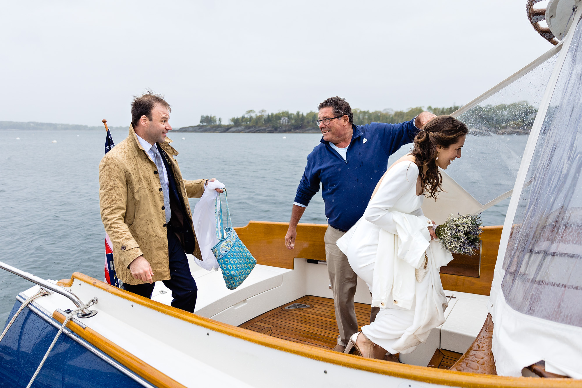 A rainy boat ride at a Boothbay Harbor Maine wedding