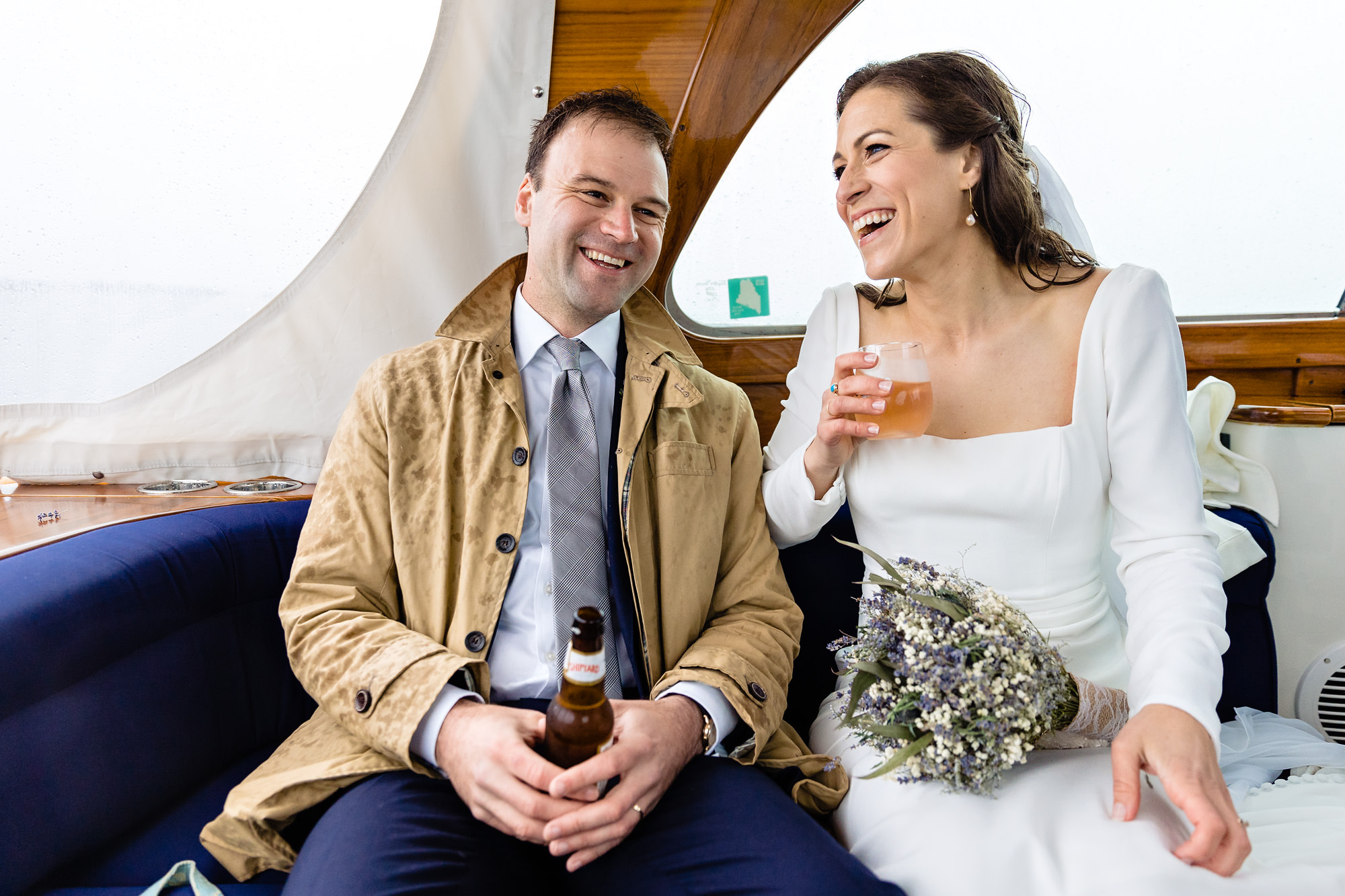 A rainy boat ride at a Boothbay Harbor Maine wedding