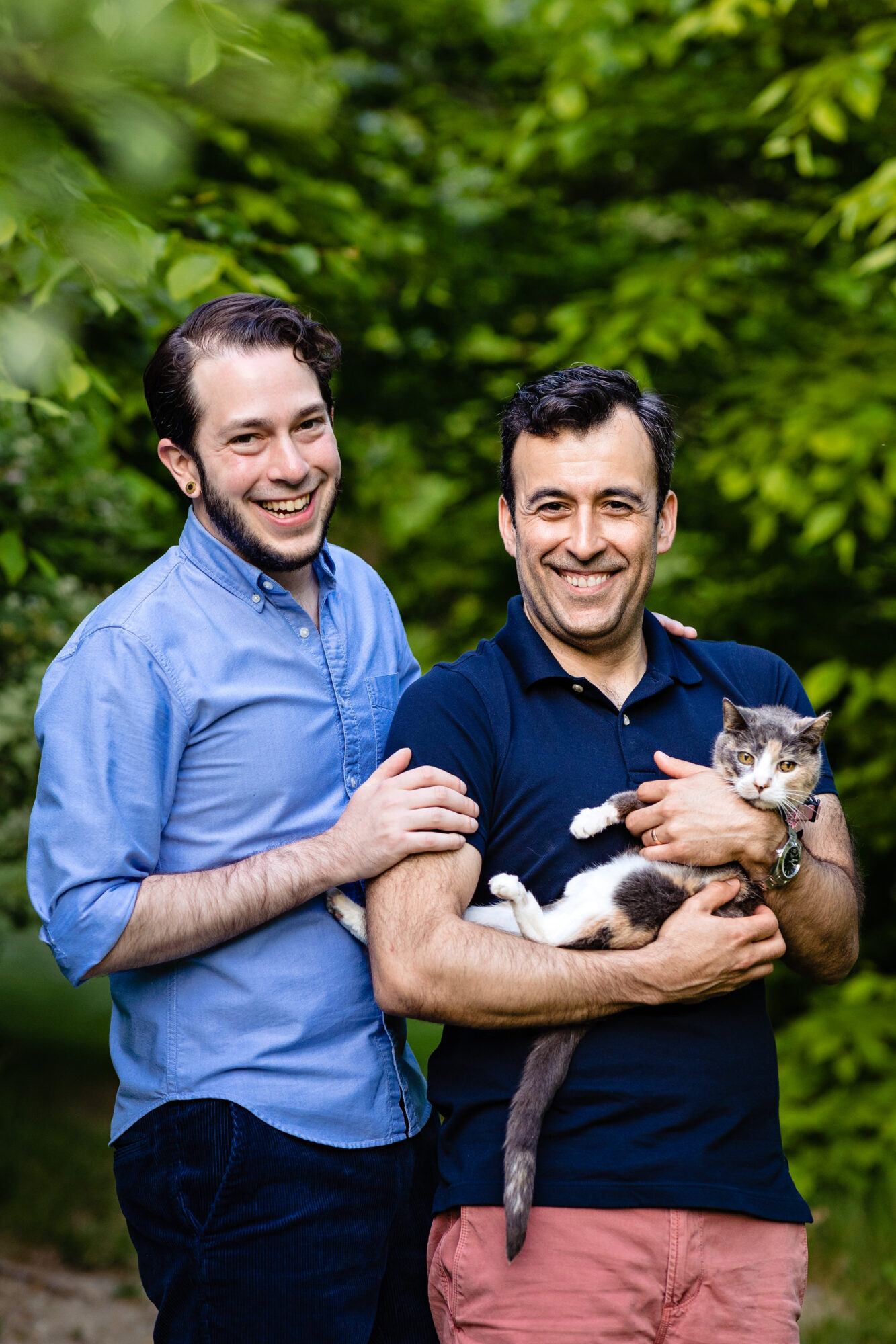 A couple poses with their cat at the Asticou Inn in Northeast Harbor, Maine.