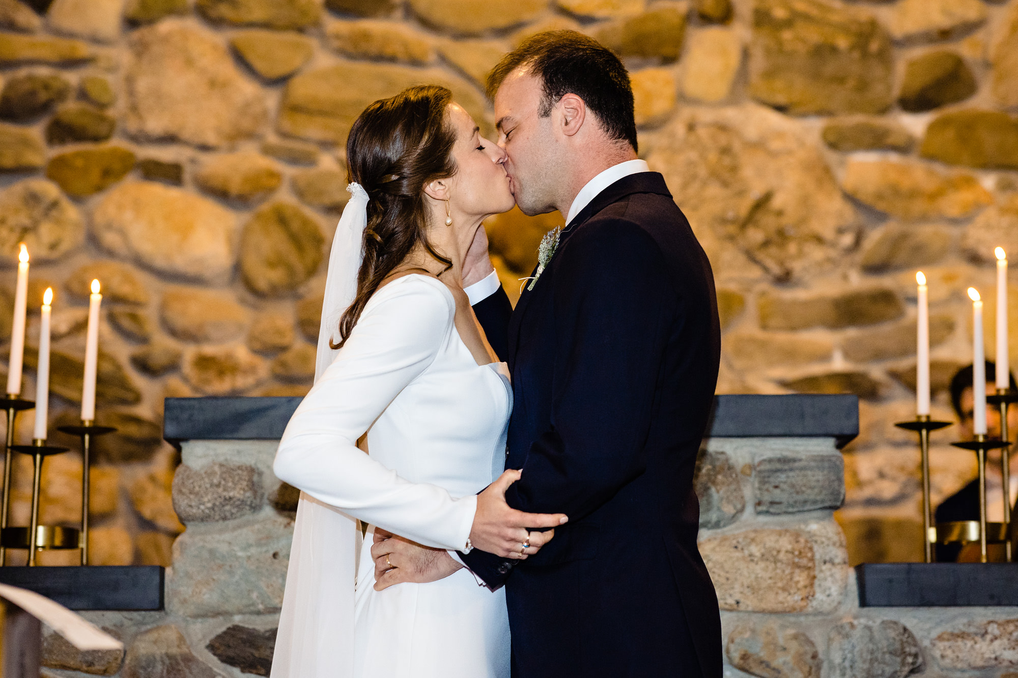 A first kiss at a Wilson Memorial Chapel wedding ceremony.