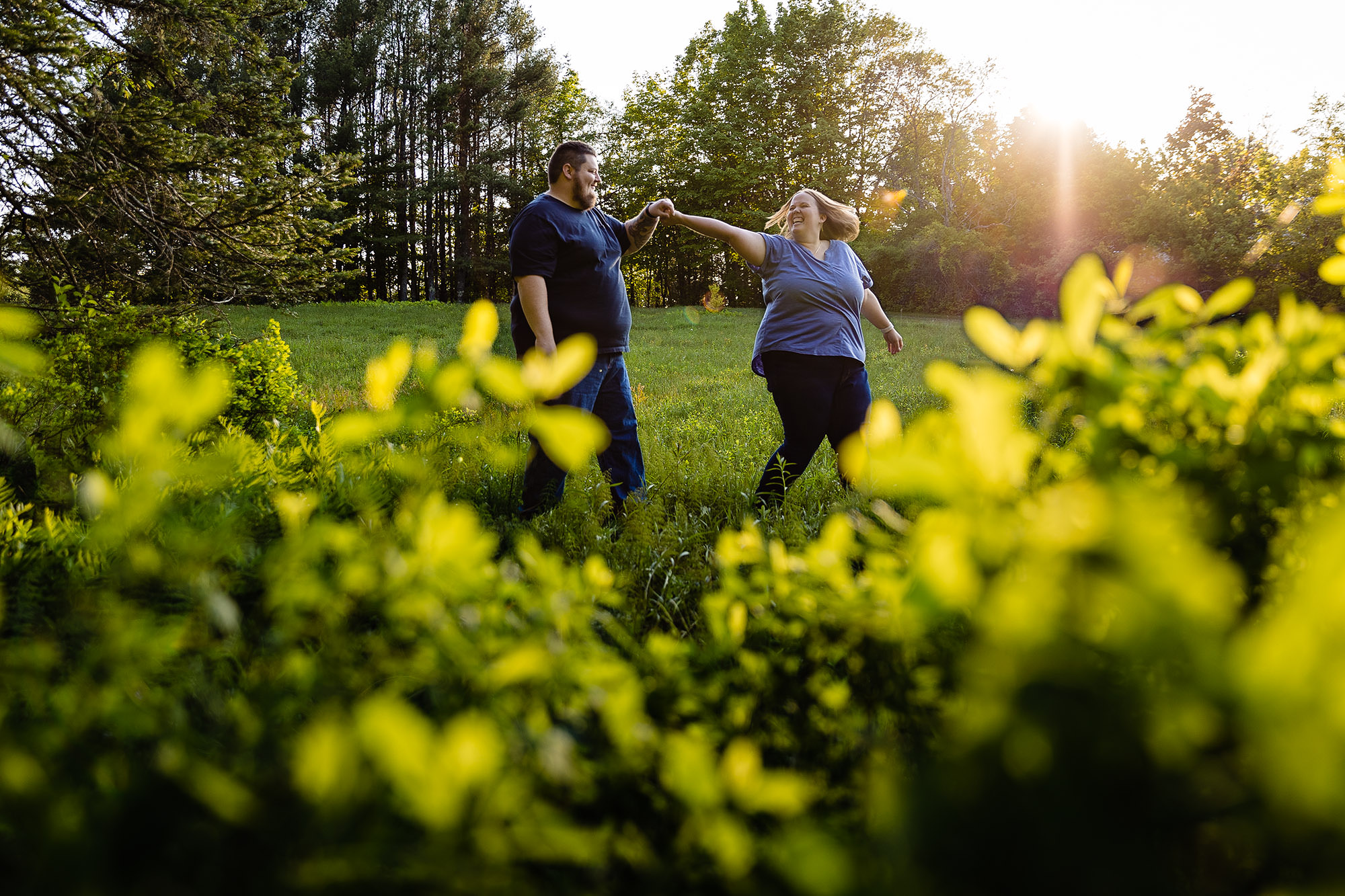 A couple dances at their Winterport Maine engagement session