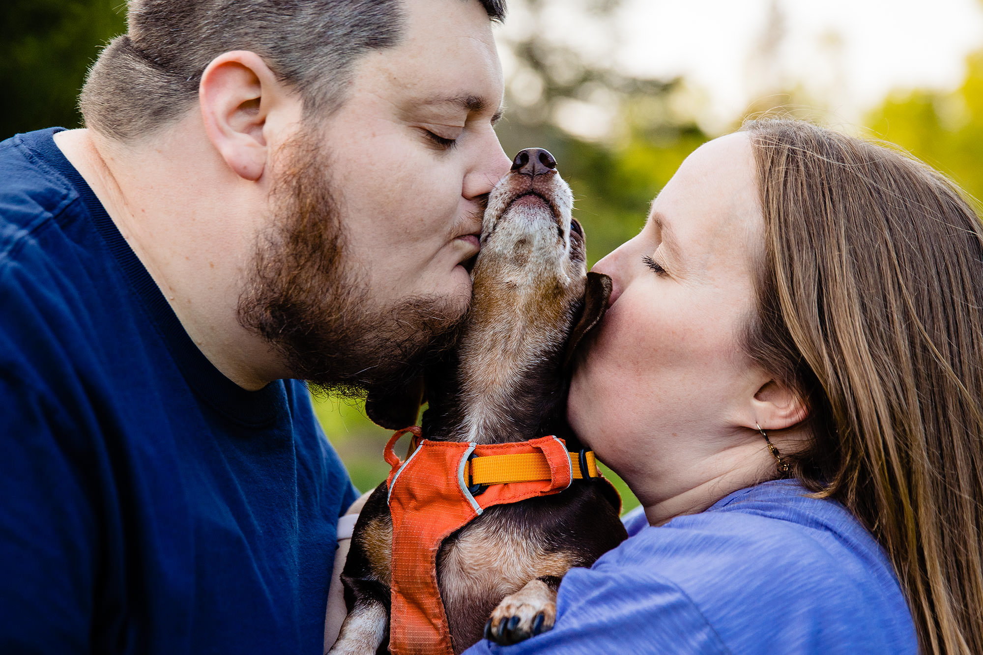 A cute engagement portrait including a dog
