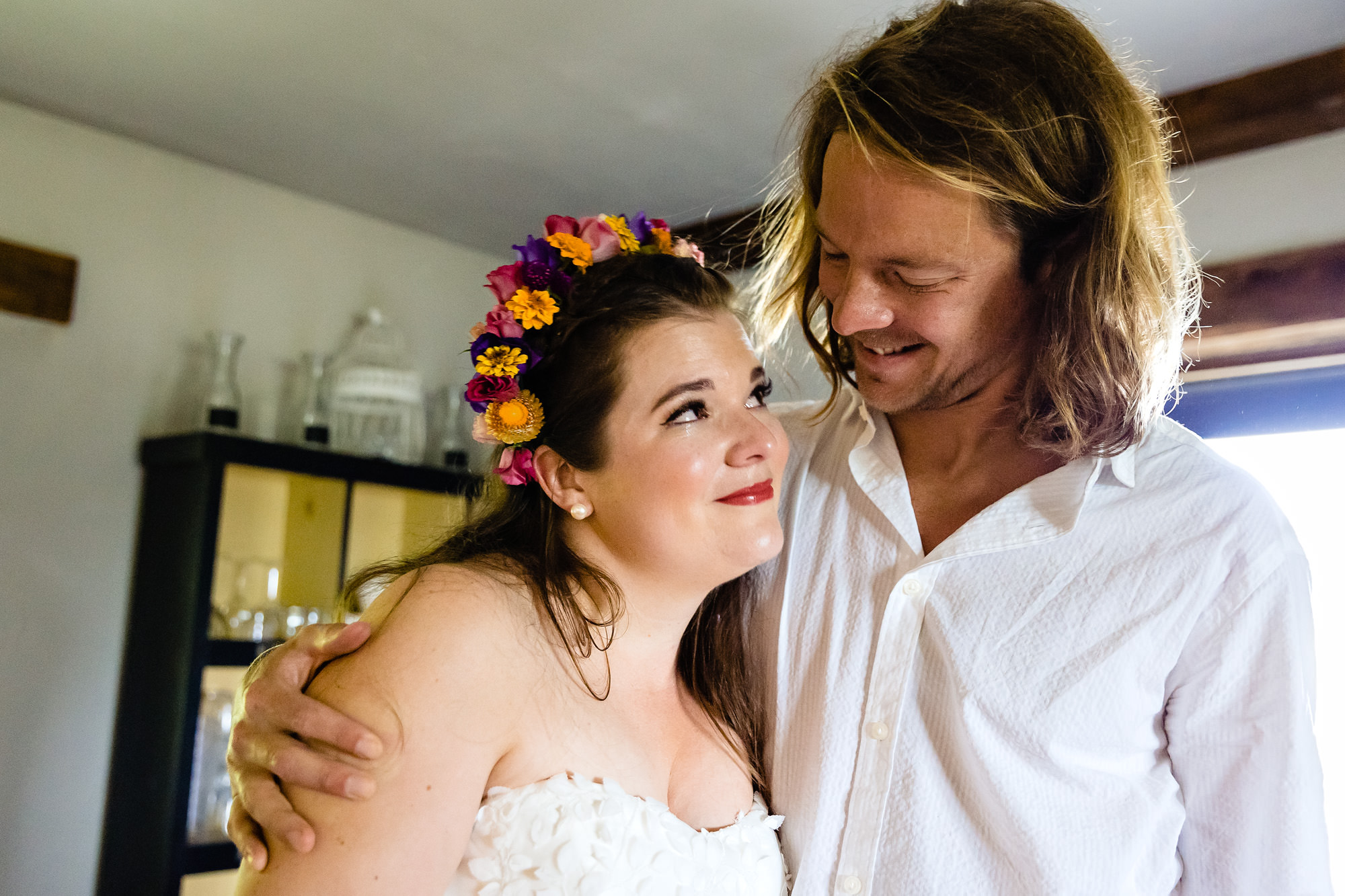 Bride shares an emotional moment with her brother at her garden wedding in Maine