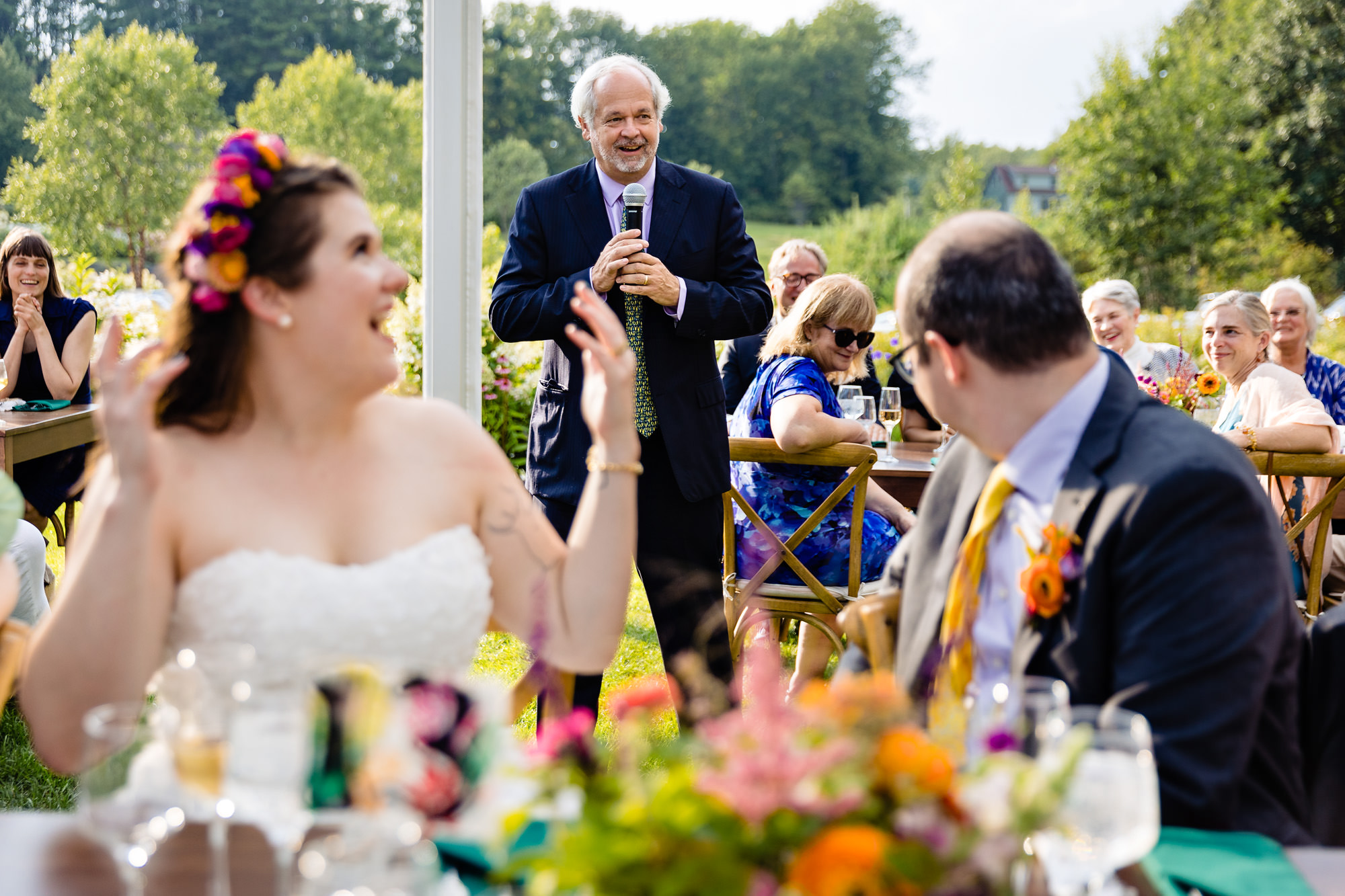 Toasts under the tent at Marianmade Farm in Wiscasset, Maine