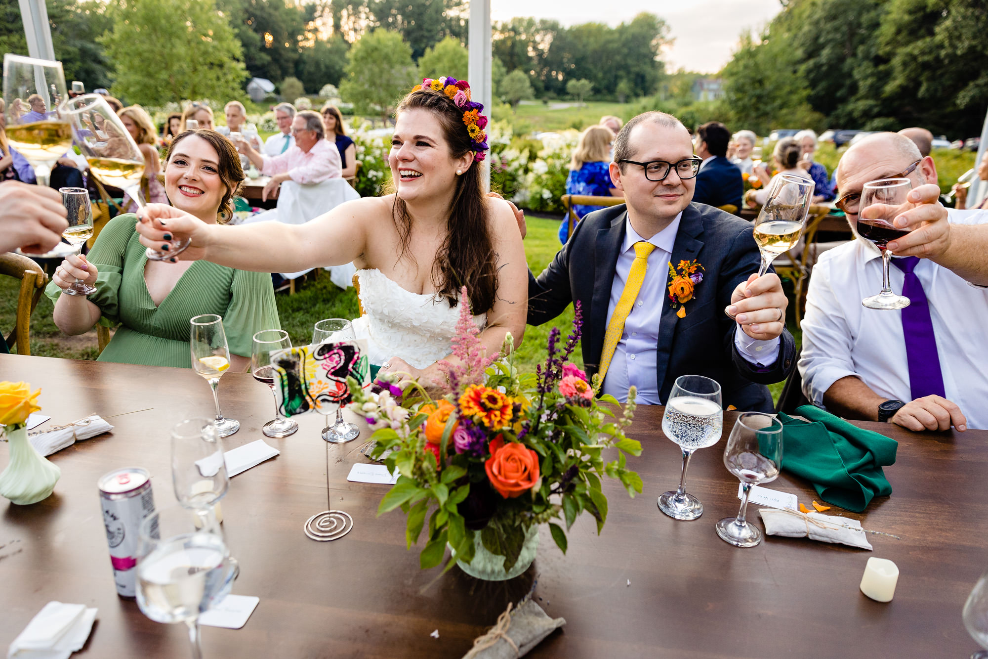 Toasts under the tent at Marianmade Farm in Wiscasset, Maine