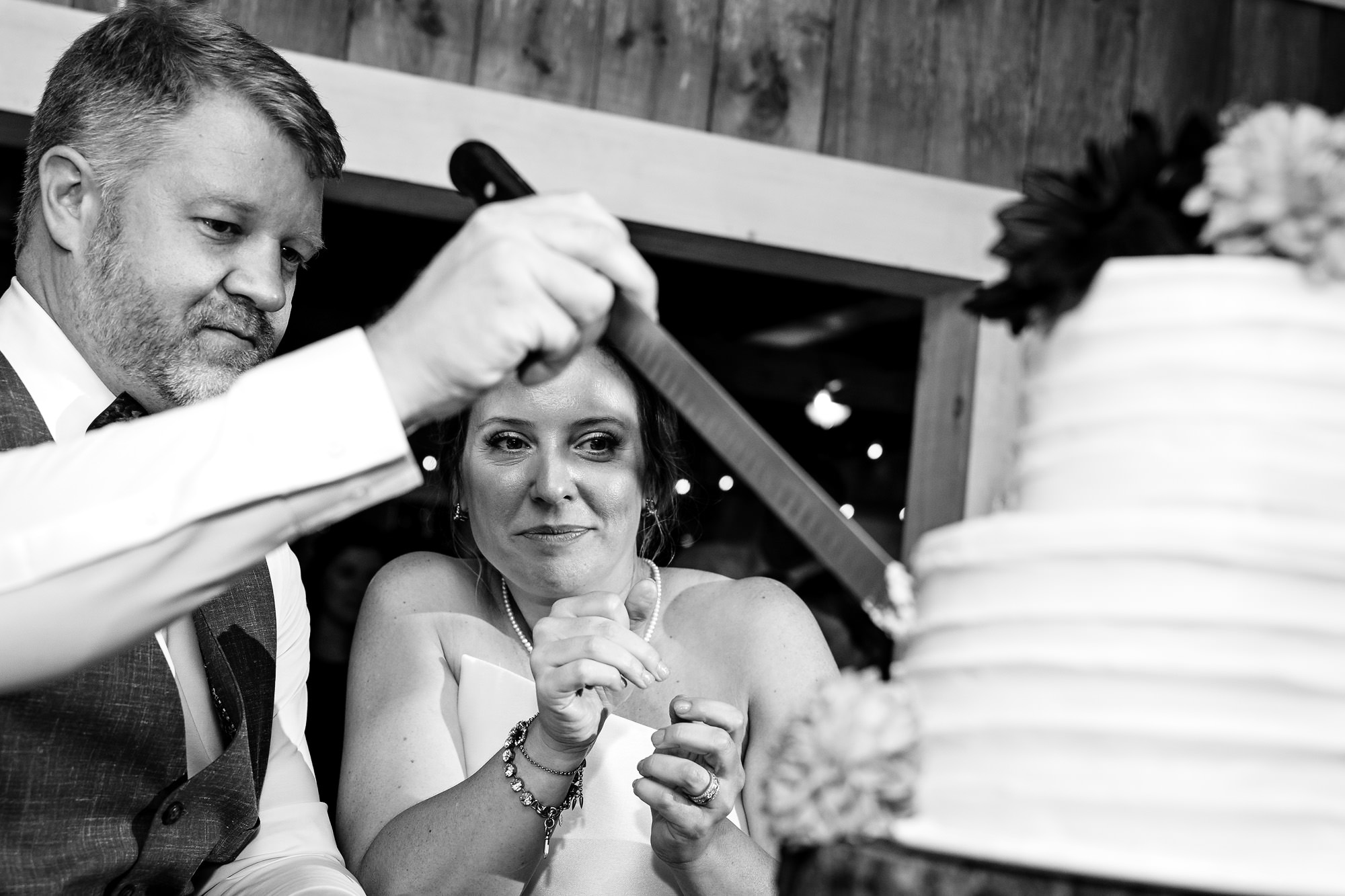 The bride and groom cut the cake at a Little Cranberry Island wedding