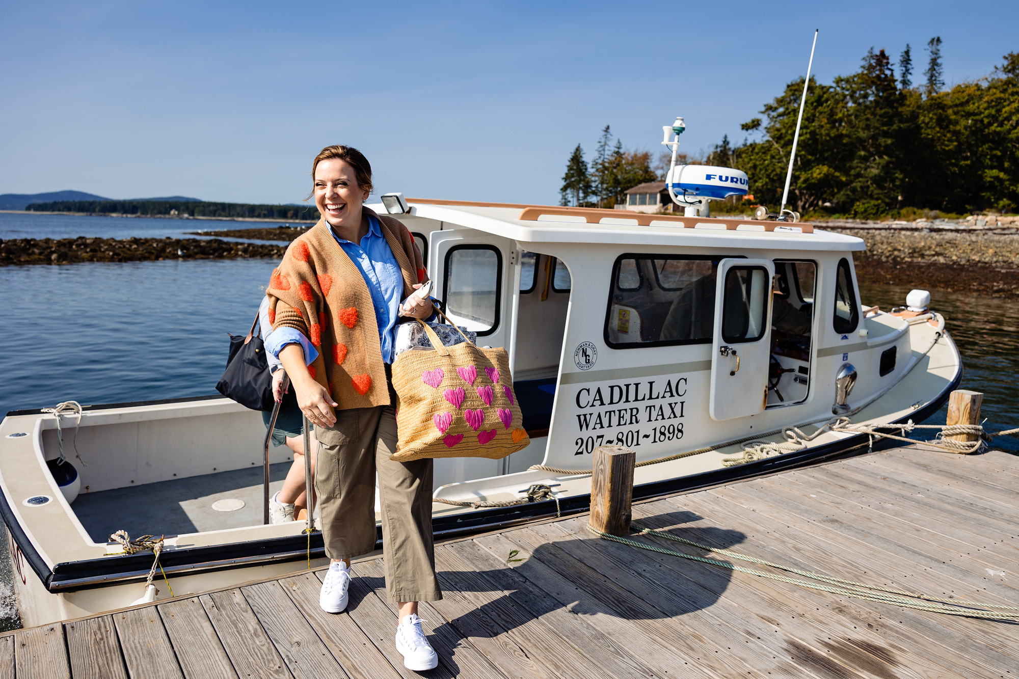 The bride takes a ferry to Little Cranberry Island for her wedding.