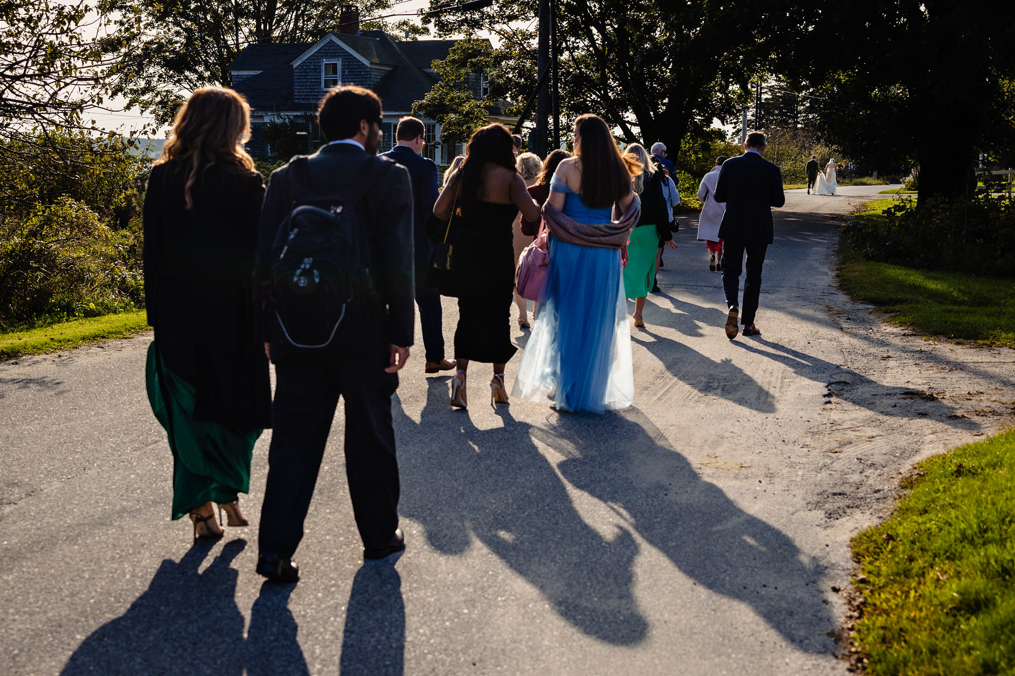 Guests walk back to a wedding reception at Islesford Dock Restaurant in Maine.