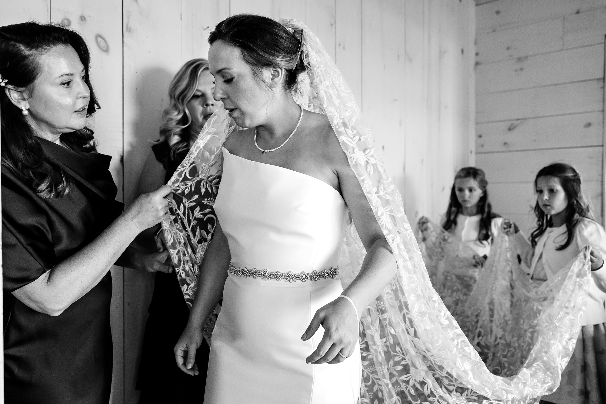 The bride gets dressed for her Islesford Dock Restaurant wedding in Maine.