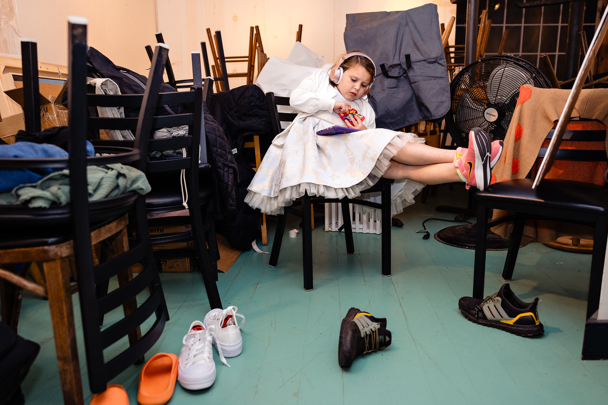 A flower girl sits in the back during a wedding at Islesford Dock Restaurant.