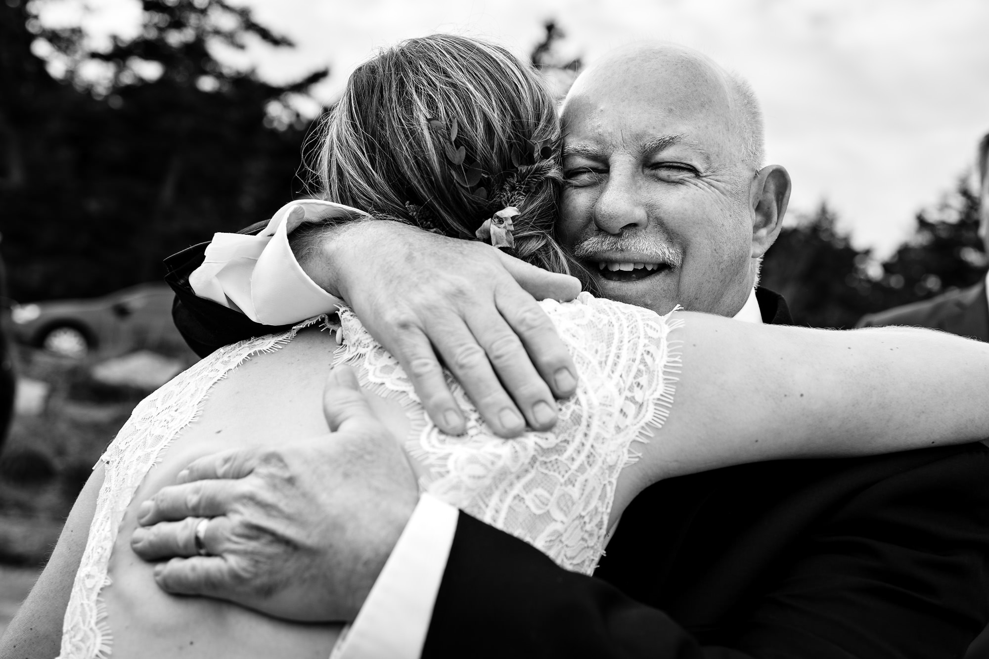Candid photos of hugs after an elopement in Acadia National Park