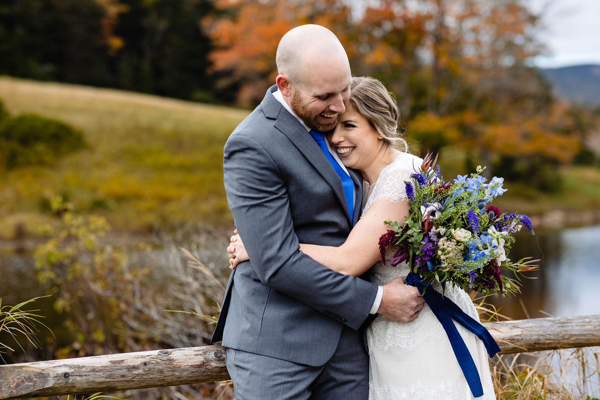 Jenna and Jordan hug during their Acadia elopement in the fall